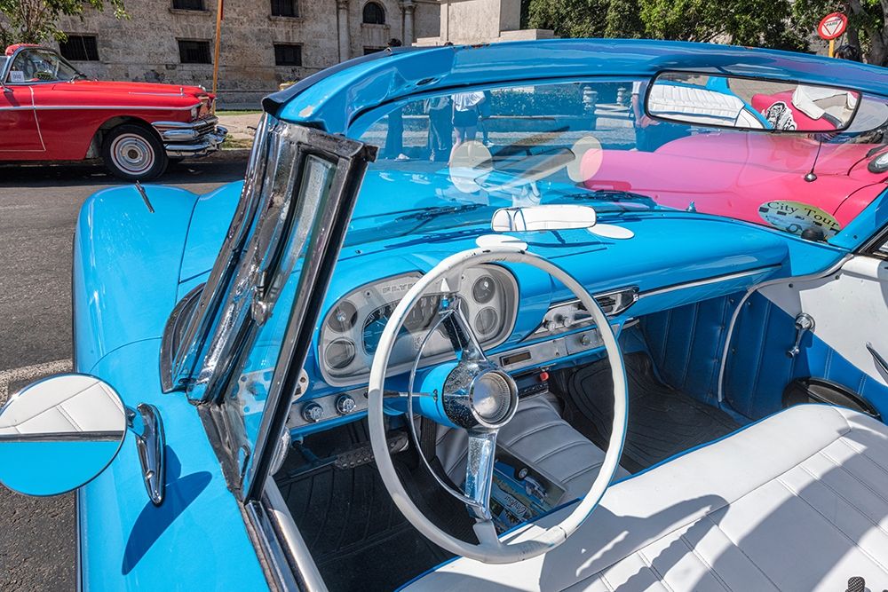 View into drivers seat of a classic convertible baby blue American car parked in Vieja-Havana-Cuba